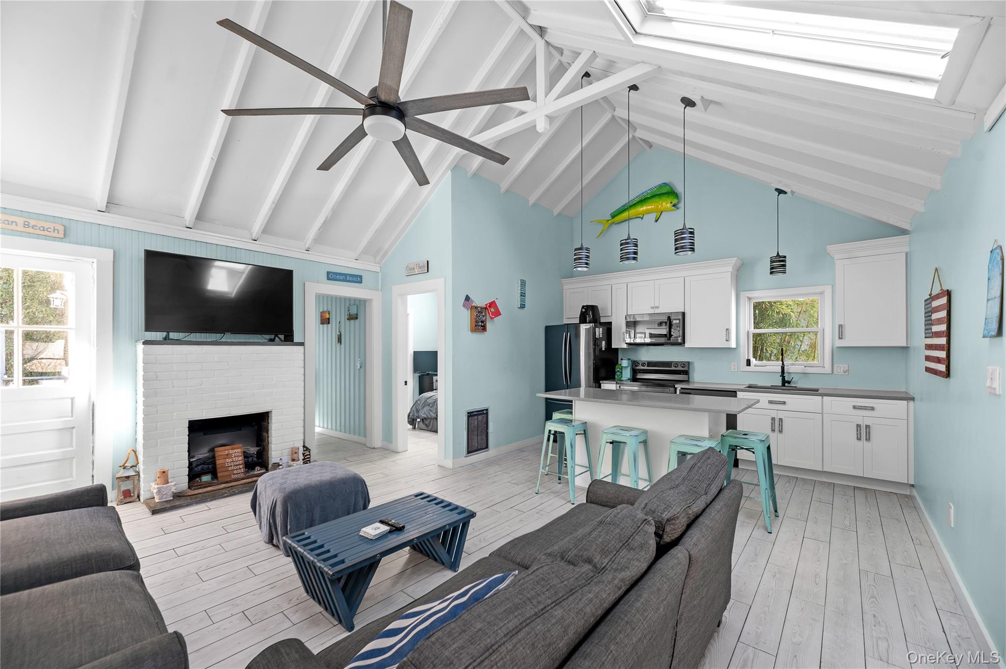 987 Surfview Walk Ocean Beach, NY 11770 - Photo 6 of 22 a living room with furniture and a fireplace
