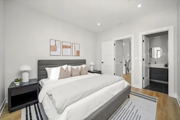 a bedroom with a bed and a walk in closet