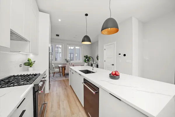 a kitchen with stove and cabinets