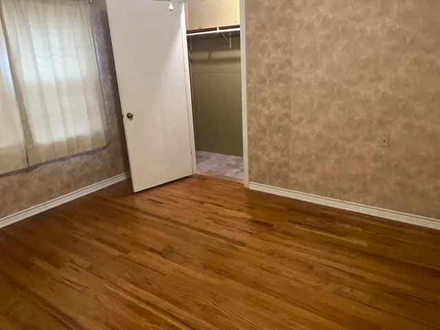 a view of a hallway with a door