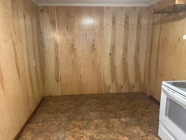 a view of a bathroom with shower curtain