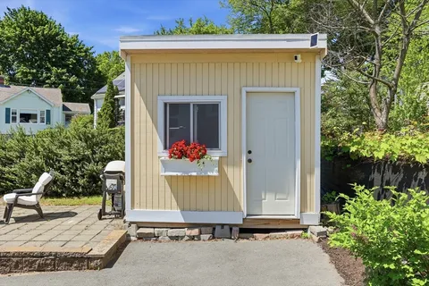 a front view of a house with garden