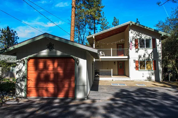 a front view of a house with yard