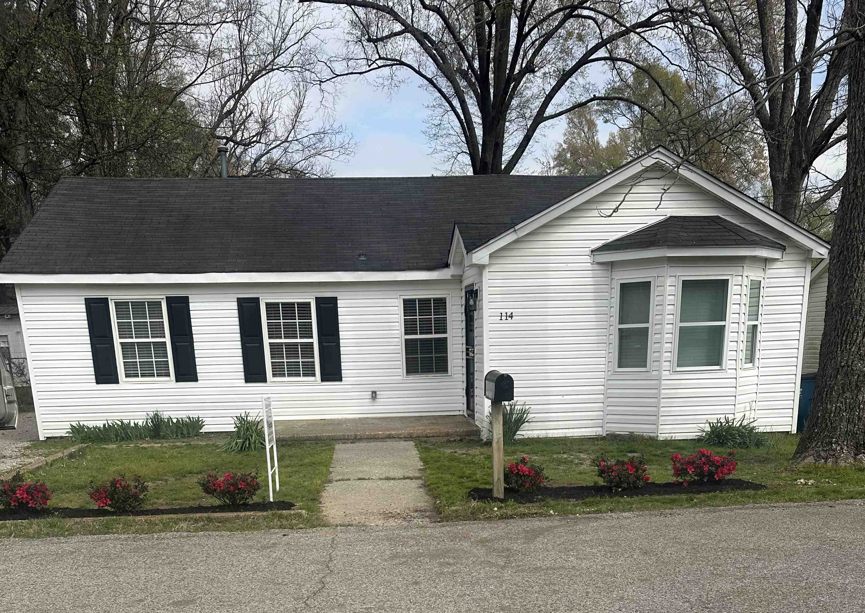 114 Boyce Avenue Covington, TN 38019 - Photo 1 of 24 a front view of a house with a yard and garage
