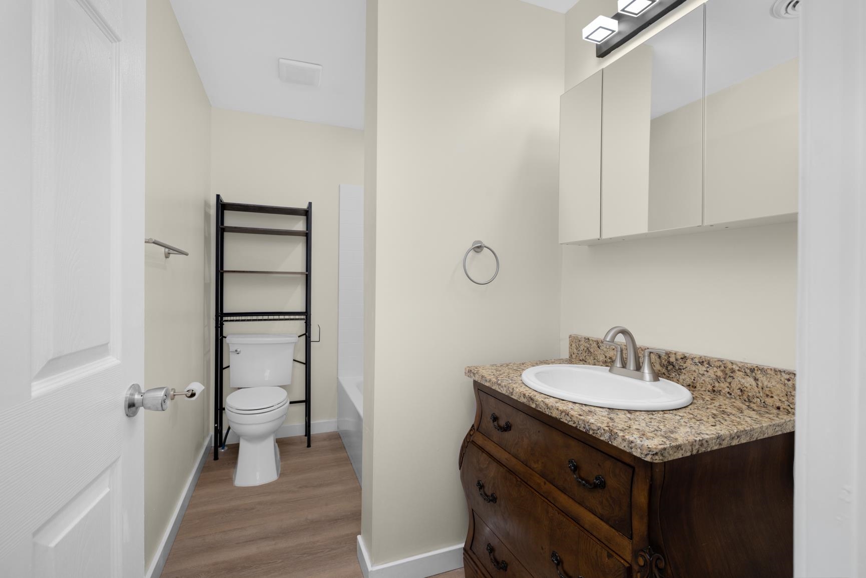 114 Boyce Avenue Covington, TN 38019 - Photo 14 of 24 a bathroom with a sink and a mirror