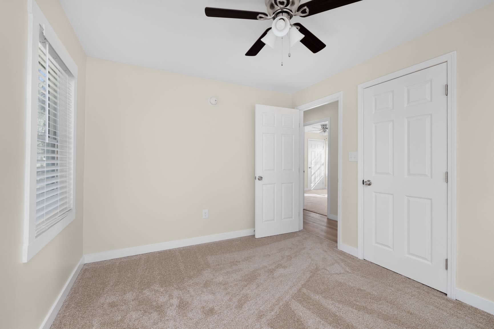 114 Boyce Avenue Covington, TN 38019 - Photo 20 of 24 a view of an empty room and chandelier fan