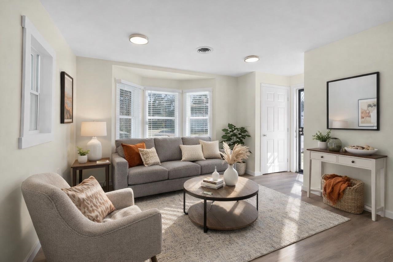 114 Boyce Avenue Covington, TN 38019 - Photo 23 of 24 a living room with furniture fireplace and a large window
