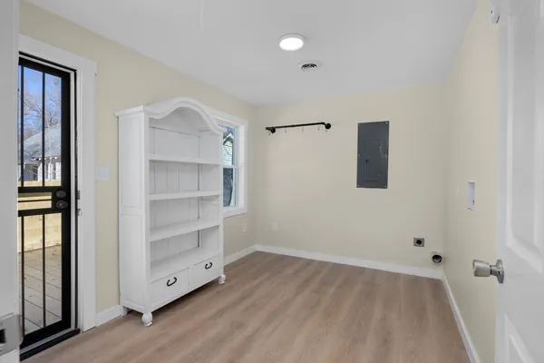 a view of an empty room with a closet