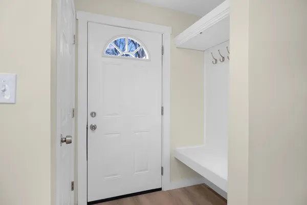 a view of an entryway with hallway