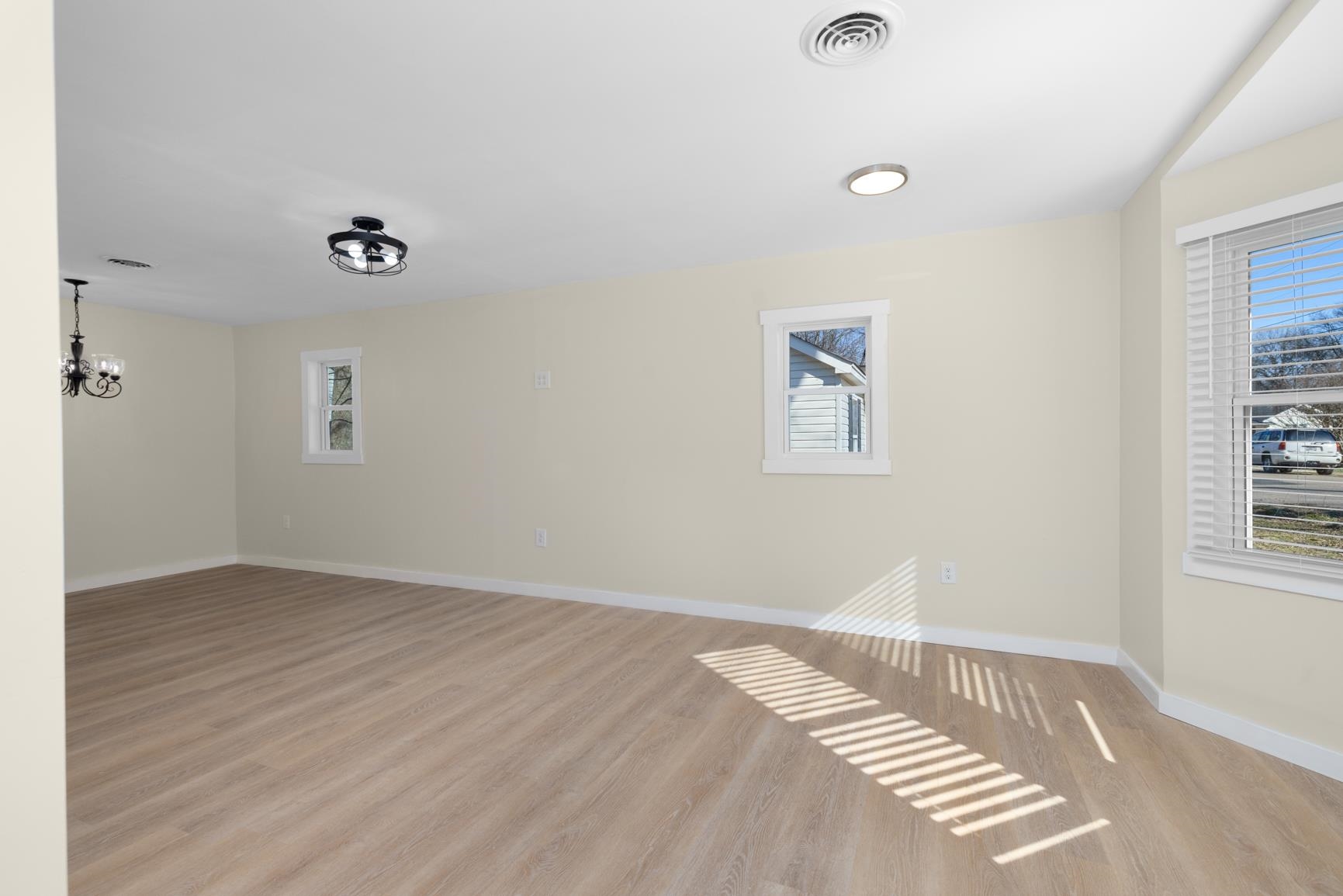 114 Boyce Avenue Covington, TN 38019 - Photo 4 of 24 an empty room with windows