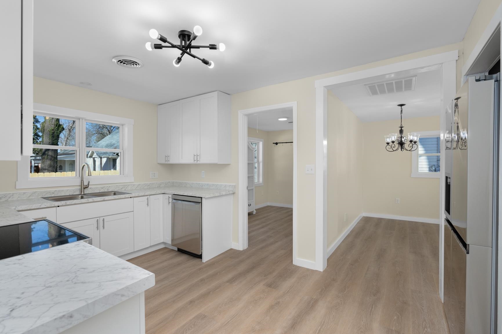 114 Boyce Avenue Covington, TN 38019 - Photo 10 of 24 a kitchen with a refrigerator and a sink
