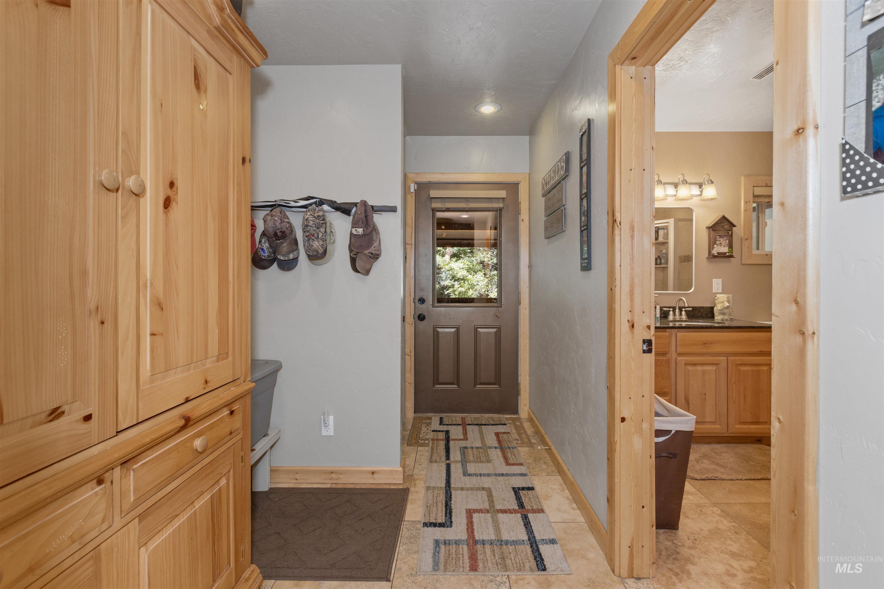 1 Miller Lane Cascade, ID 83611 - Photo 17 of 39 Hallway with baseboards and a sink
