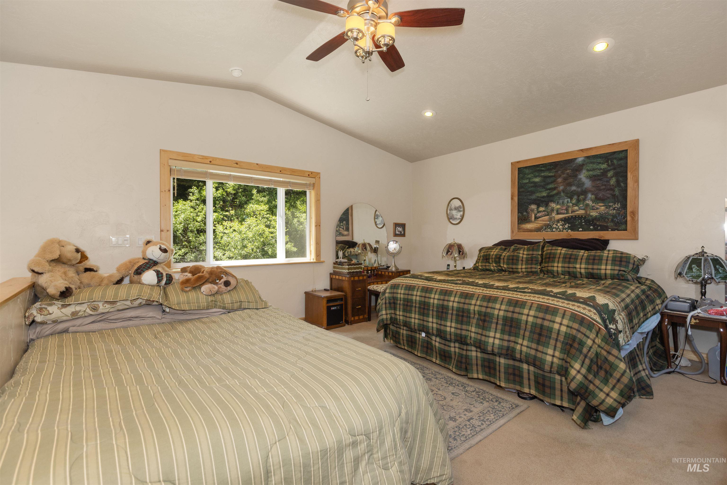 1 Miller Lane Cascade, ID 83611 - Photo 27 of 39 Carpeted bedroom featuring lofted ceiling, a ceiling fan, and recessed lighting