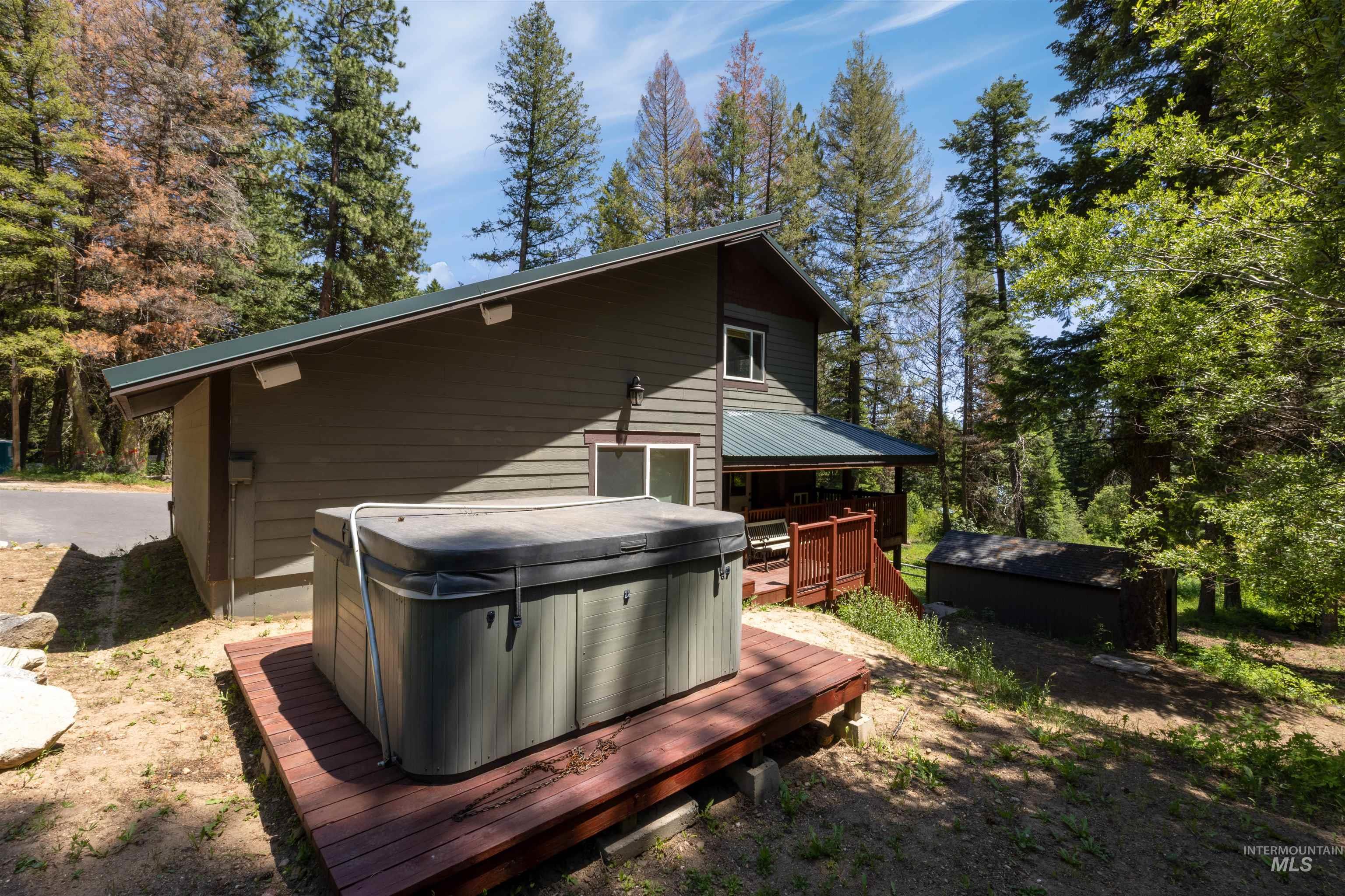 1 Miller Lane Cascade, ID 83611 - Photo 31 of 39 Rear view of property featuring a hot tub and a deck
