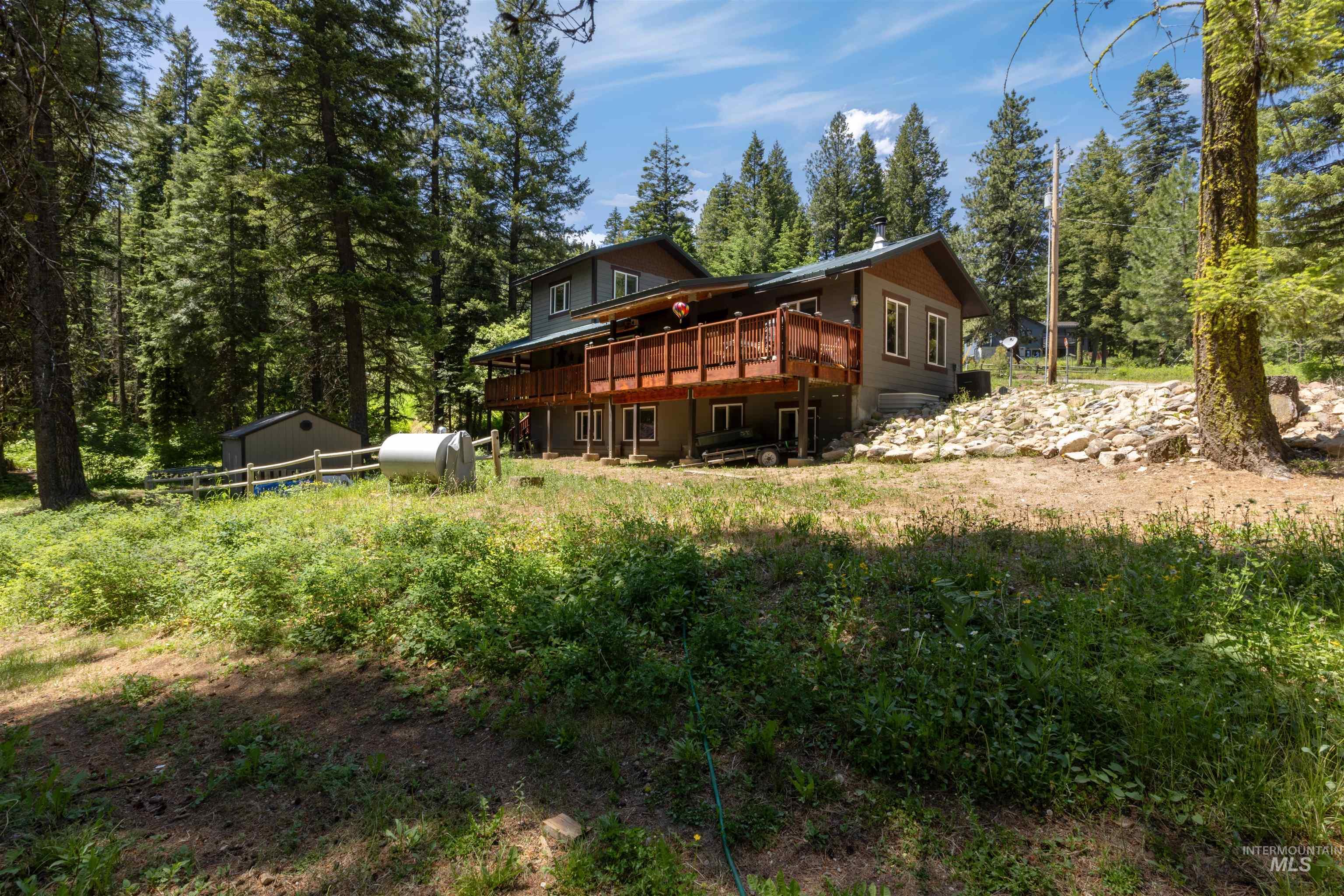 1 Miller Lane Cascade, ID 83611 - Photo 33 of 39 Rear view of house featuring a shed, a deck, and heating fuel