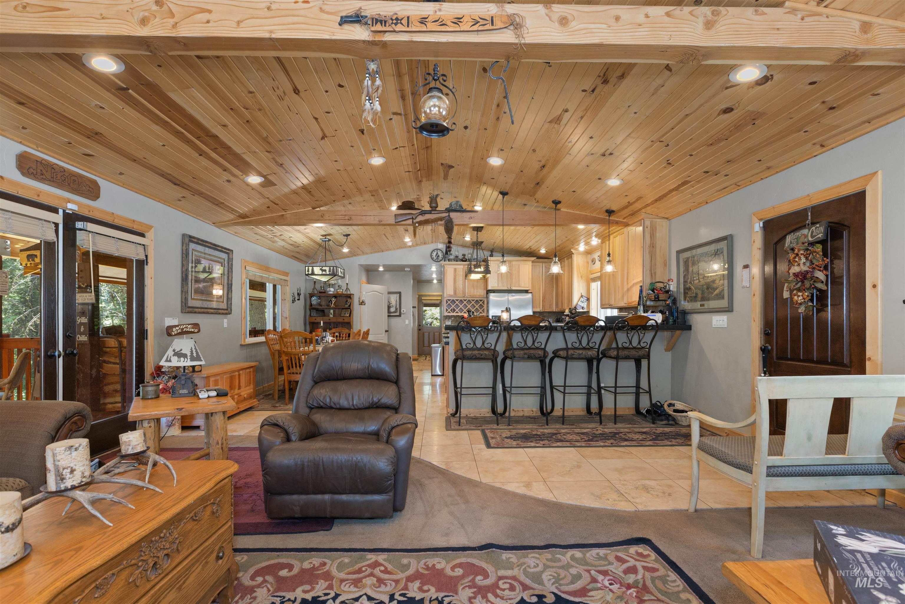 1 Miller Lane Cascade, ID 83611 - Photo 6 of 39 Living room featuring light tile patterned flooring, lofted ceiling, recessed lighting, wooden ceiling, and french doors