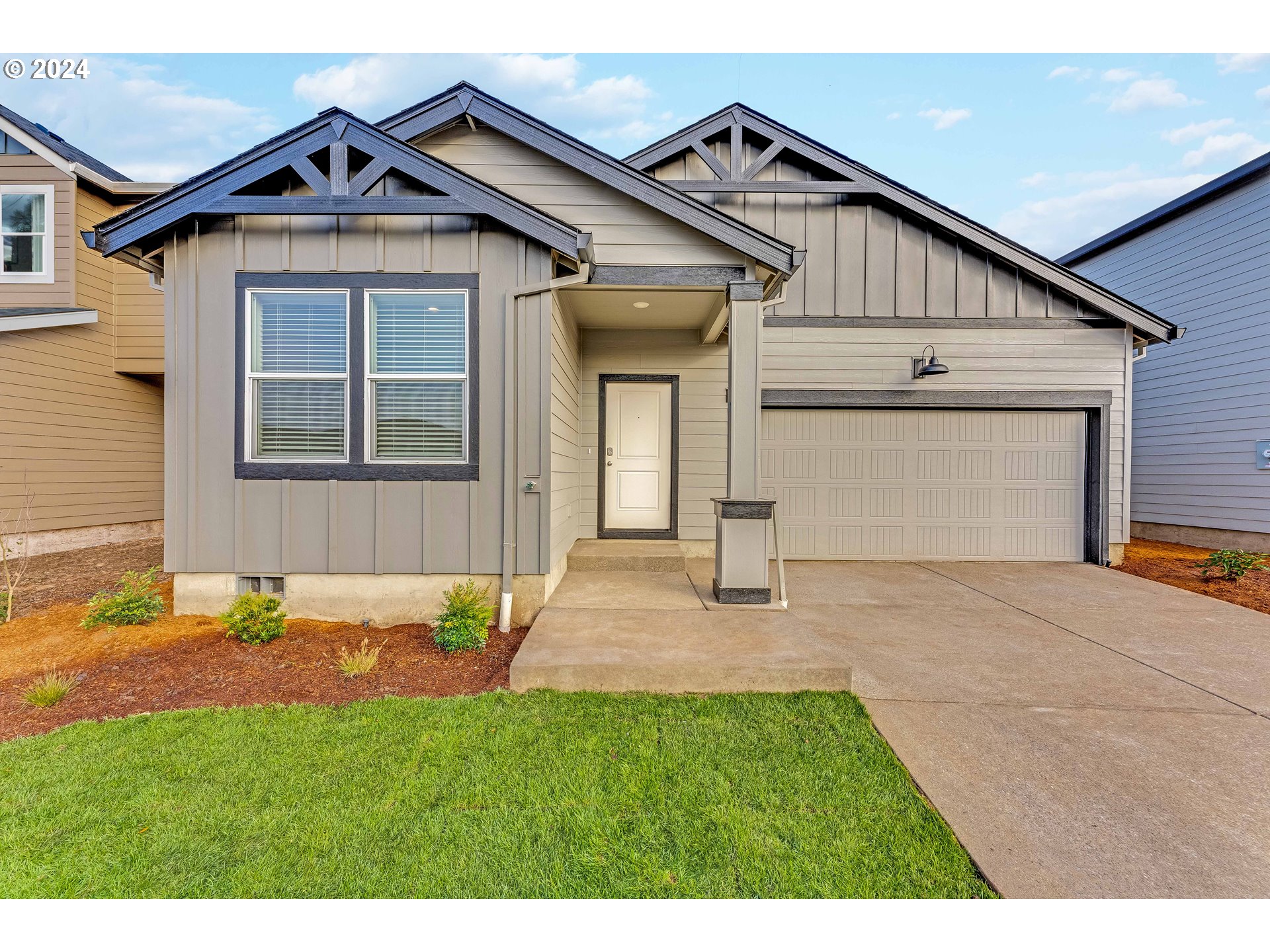 2959 V Street Springfield, OR 97477 - Photo 1 of 28 a front view of a house with a yard and garage