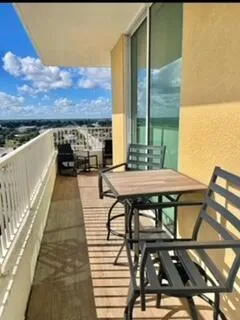 a terrace with outdoor seating and city view