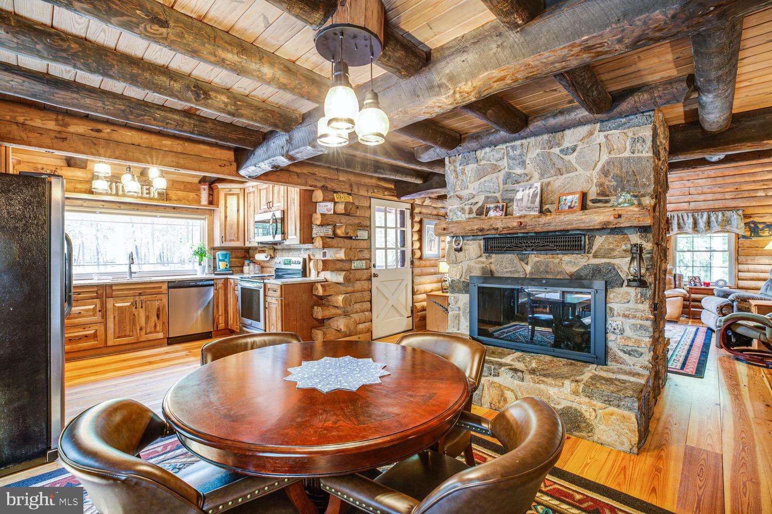 1735 Log Cabin Road Beaverdam, VA 23015 - Photo 11 of 73 Dining Area with Double Sided Gas Fireplace!