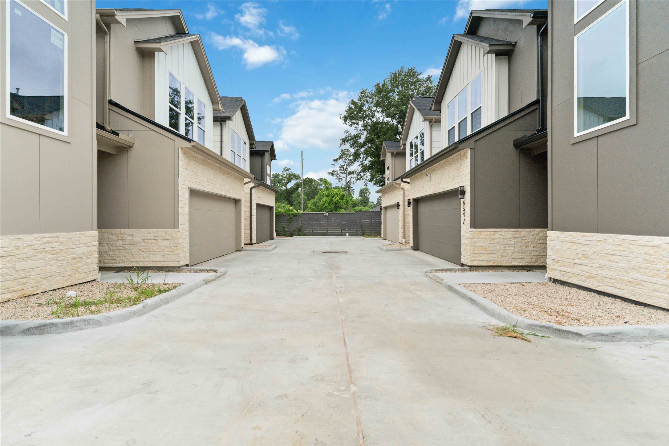 6539 Sealey Street Houston, TX 77091 - Photo 4 of 28 a view of a white building next to a yard