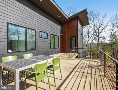a view of house with swimming pool outdoor seating