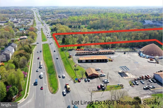 an aerial view of swimming pool playground and mountain view
