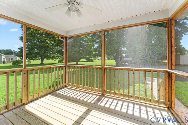 a view of a balcony with wooden floor