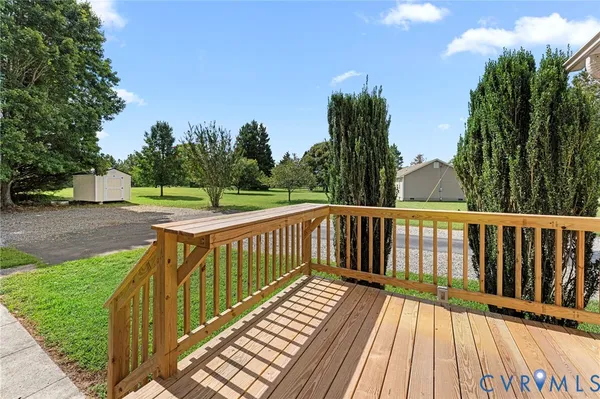 a view of outdoor space with deck and yard