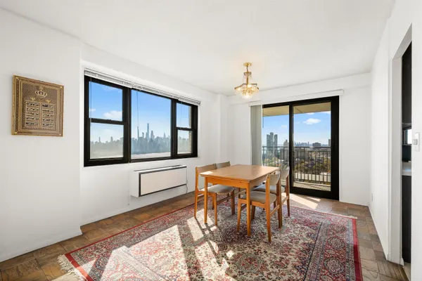 a dining room with a table and chairs