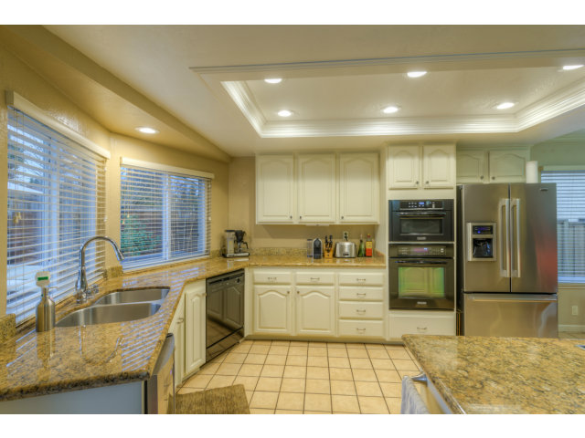 3311 Veracruz Drive San Ramon, CA 94583 - Photo 6 of 21 a kitchen with stainless steel appliances granite countertop a sink stove and refrigerator