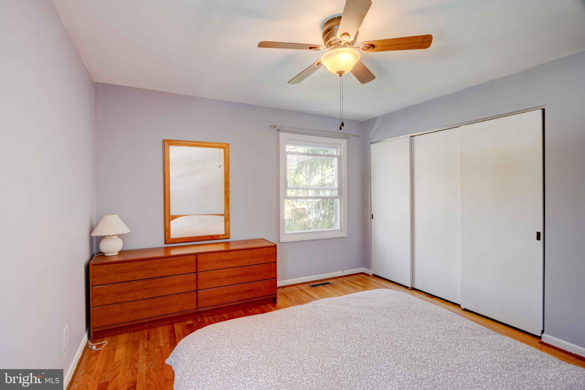 1320 Denby Road Towson, MD 21286 - Photo 25 of 39 a bedroom with a bed and a chandelier