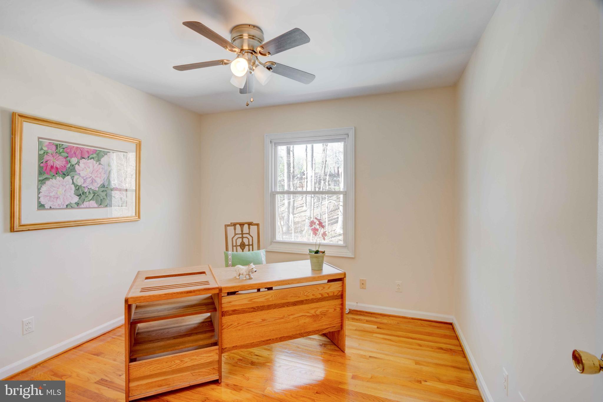 1320 Denby Road Towson, MD 21286 - Photo 26 of 39 a spacious bedroom with a bed and a chandelier