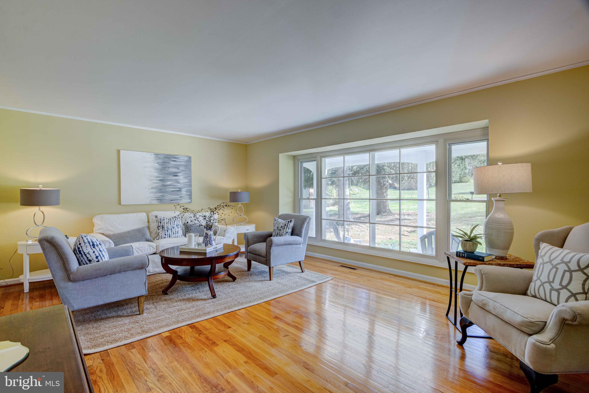 1320 Denby Road Towson, MD 21286 - Photo 9 of 39 a living room with furniture and a large window with wooden floor