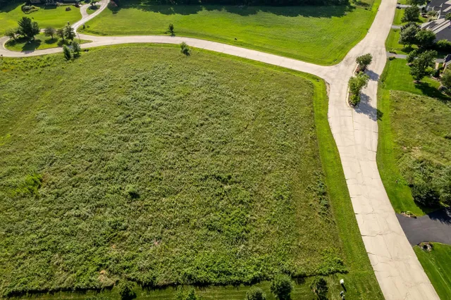 a bathroom with a swimming pool and green space