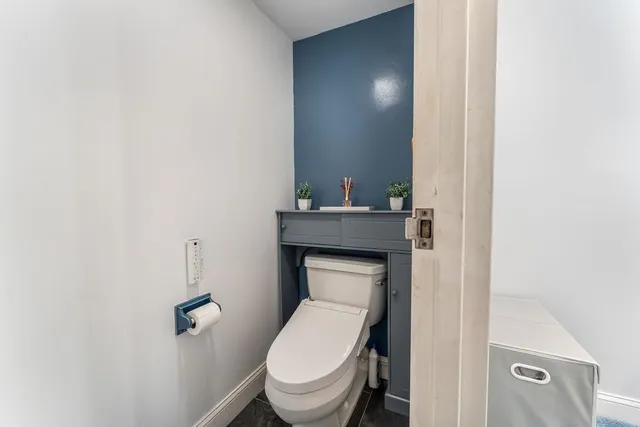 a bathroom with a toilet and a sink
