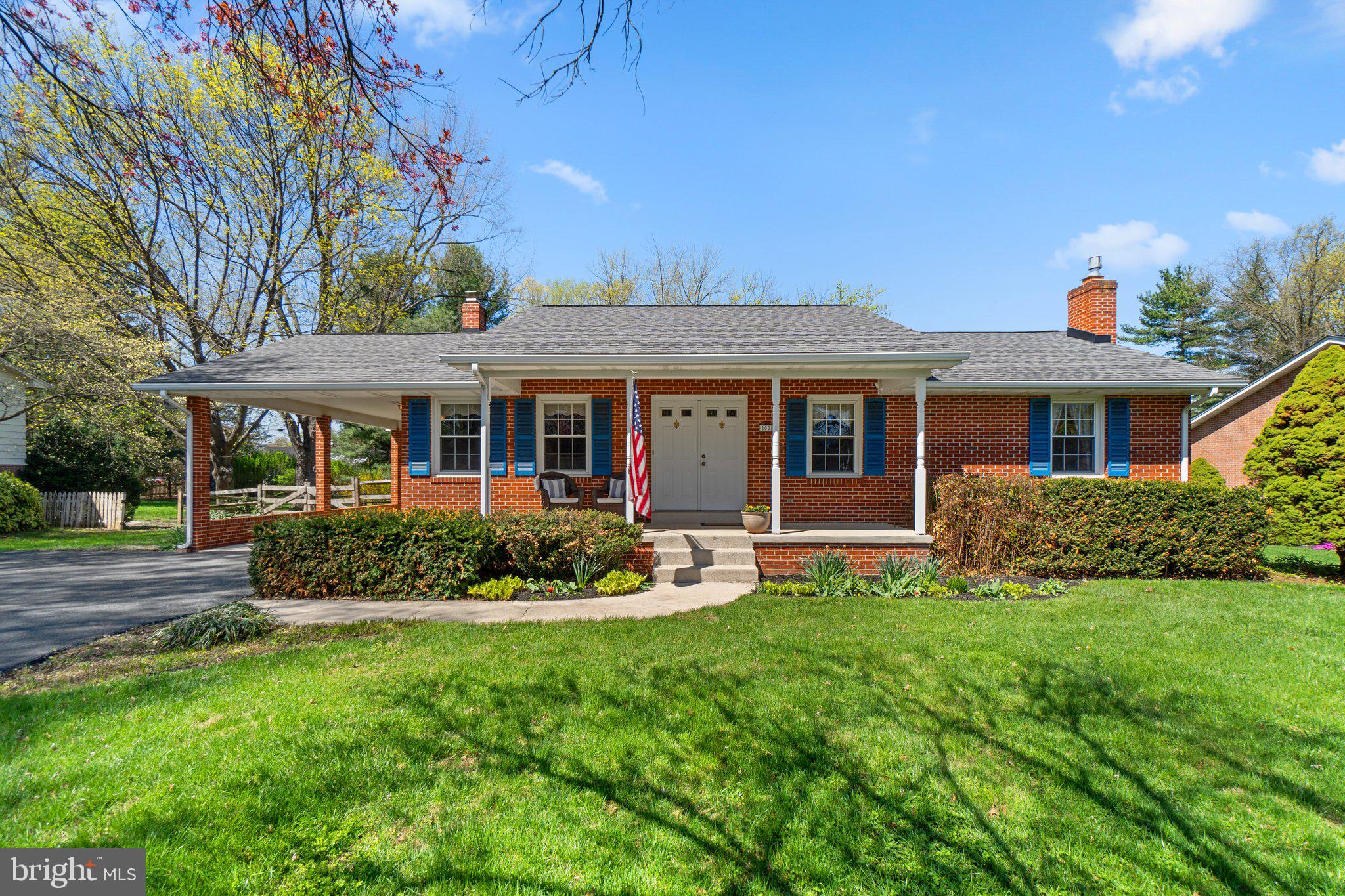 front view of a house with a yard