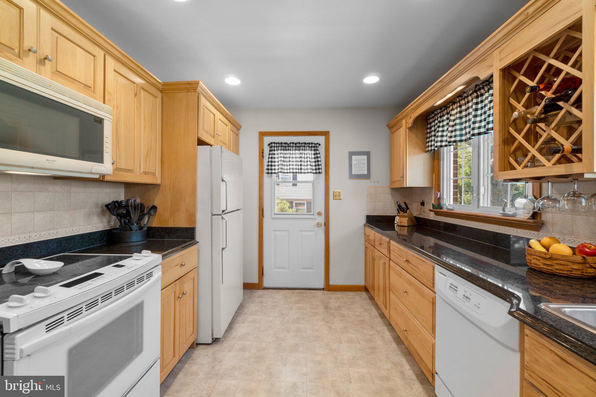 8008 Meadowview Drive Frederick, MD 21702 - Photo 13 of 42 a kitchen with stainless steel appliances a stove a sink and a refrigerator