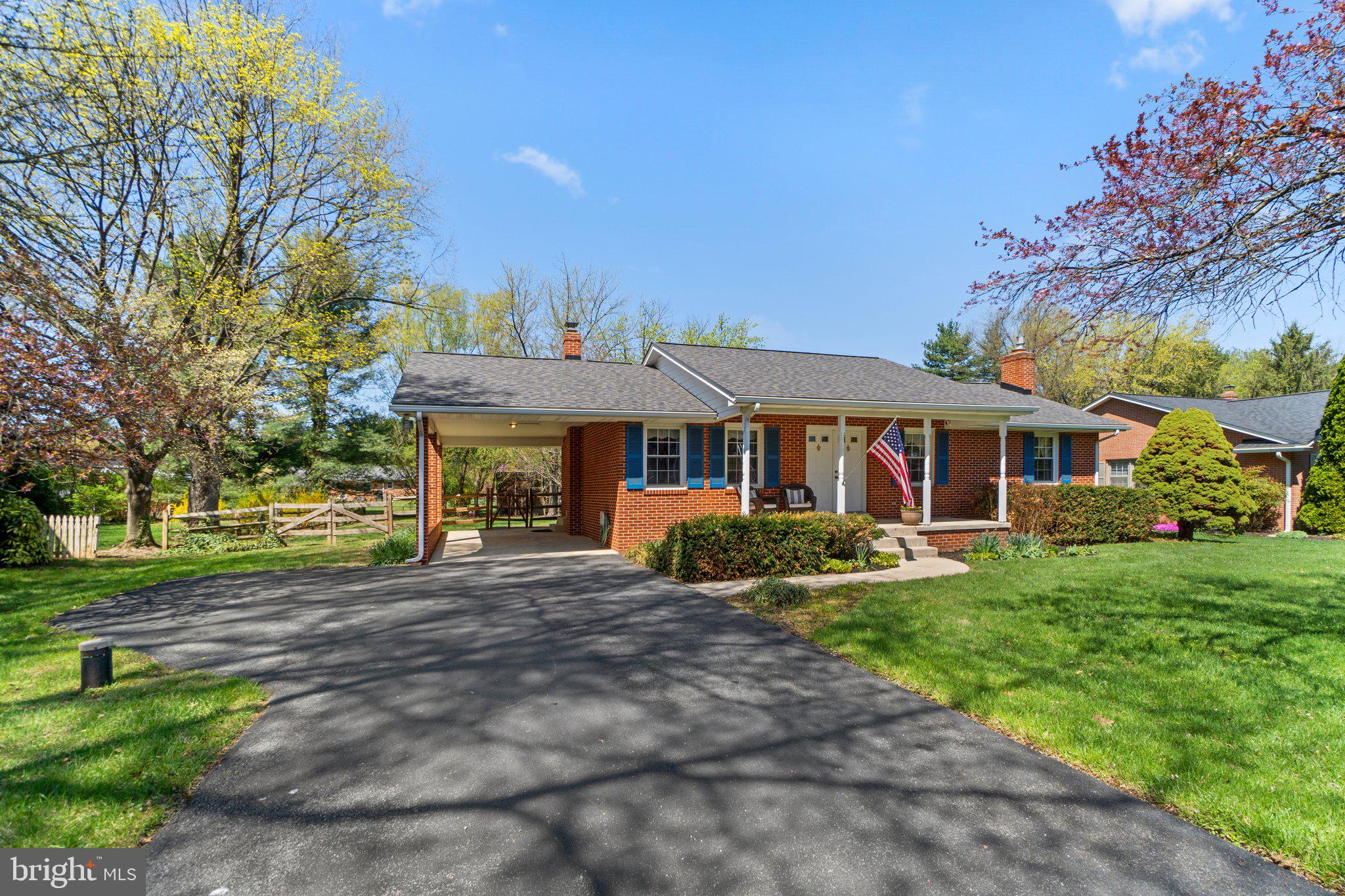 8008 Meadowview Drive Frederick, MD 21702 - Photo 2 of 42 a front view of a house with garden