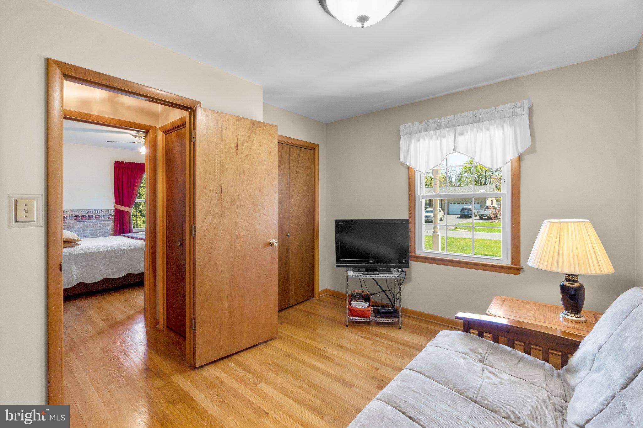 8008 Meadowview Drive Frederick, MD 21702 - Photo 25 of 42 a bedroom with a bed and wooden floor