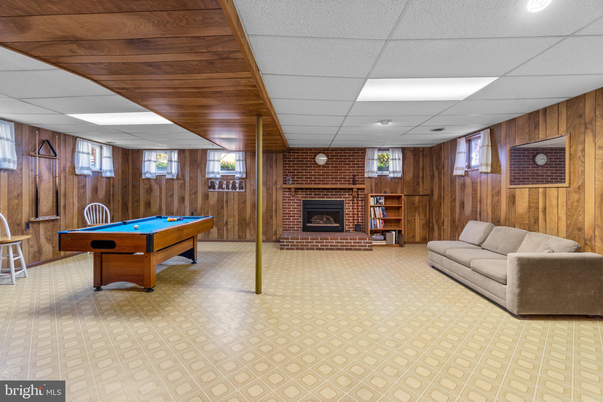 8008 Meadowview Drive Frederick, MD 21702 - Photo 30 of 42 a living room with furniture and a fireplace