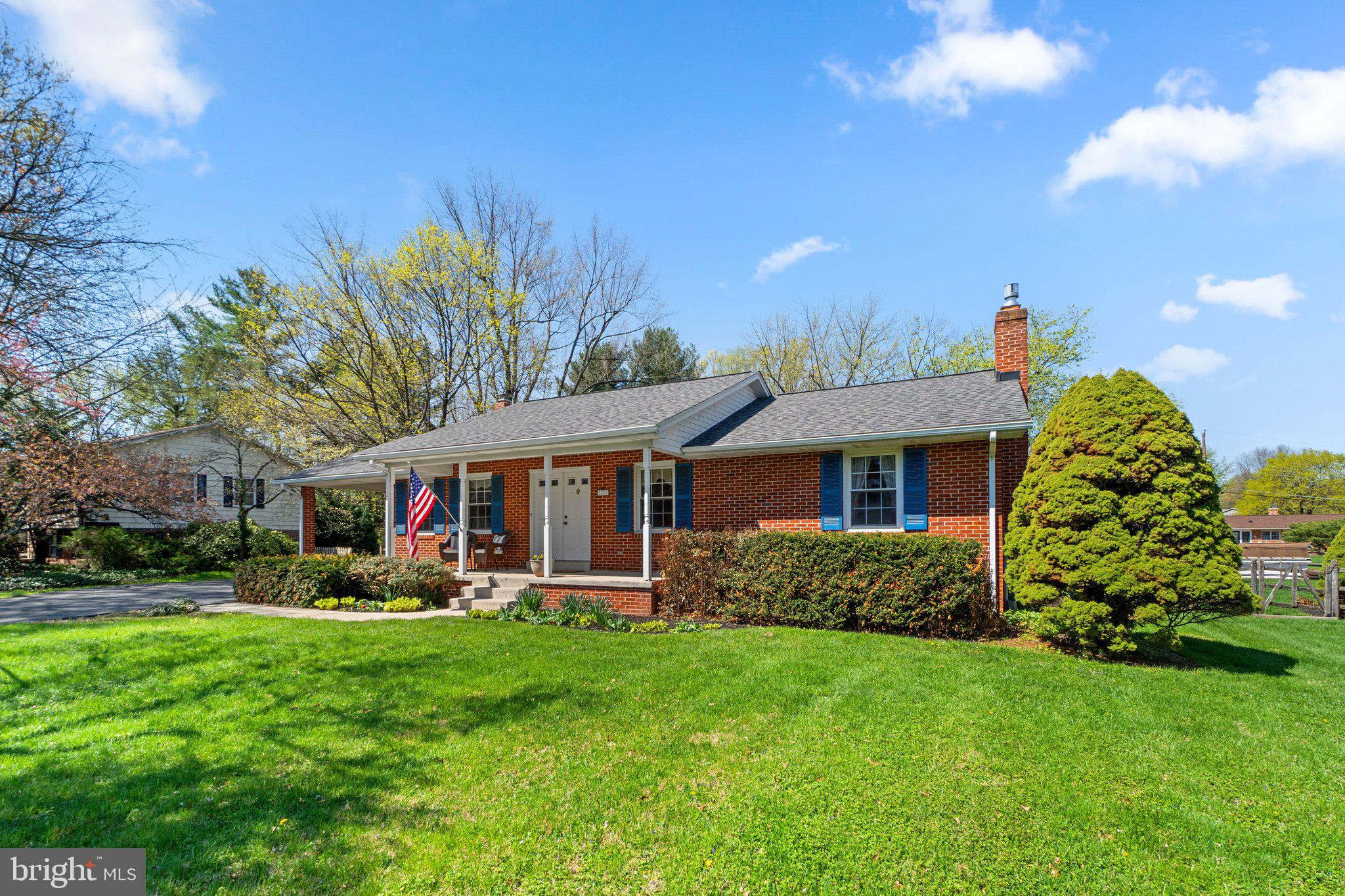 8008 Meadowview Drive Frederick, MD 21702 - Photo 3 of 42 a front view of a house with garden