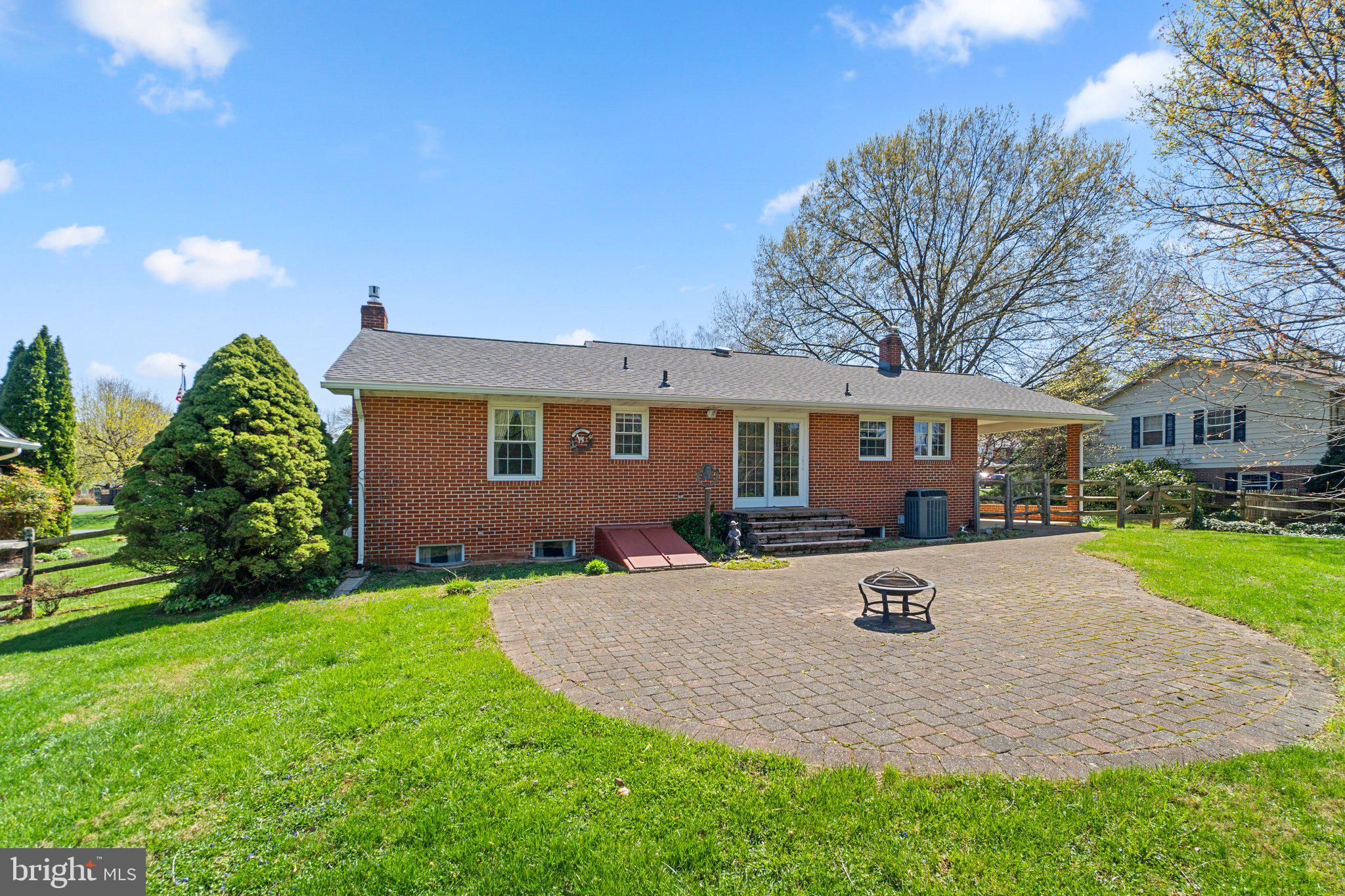 8008 Meadowview Drive Frederick, MD 21702 - Photo 40 of 42 a front view of a house with a yard and trees