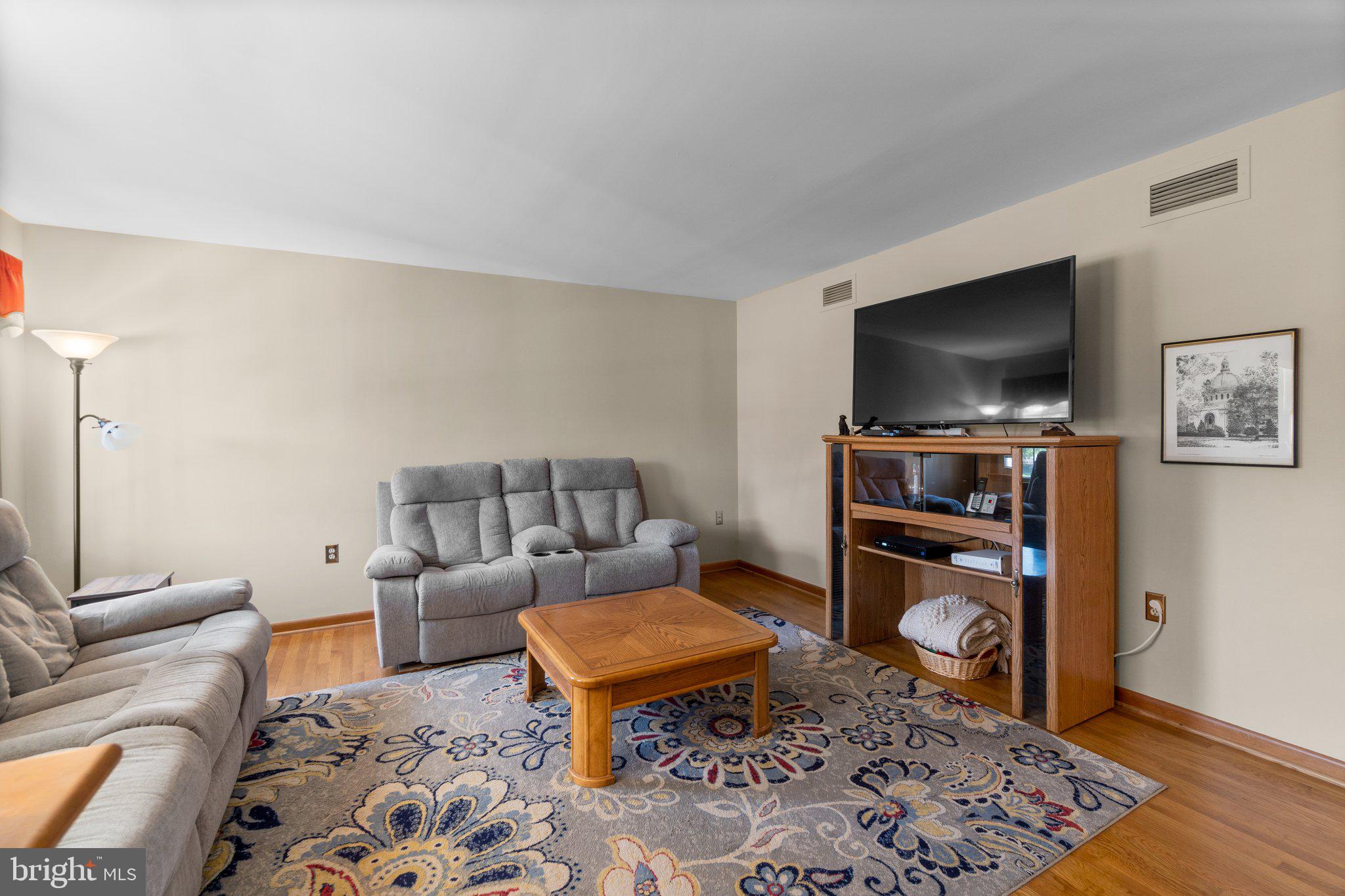 8008 Meadowview Drive Frederick, MD 21702 - Photo 4 of 42 a living room with furniture and a flat screen tv