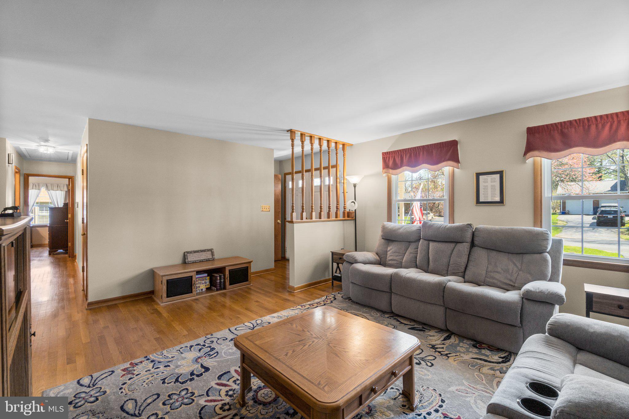8008 Meadowview Drive Frederick, MD 21702 - Photo 7 of 42 a living room with furniture and a wooden floor
