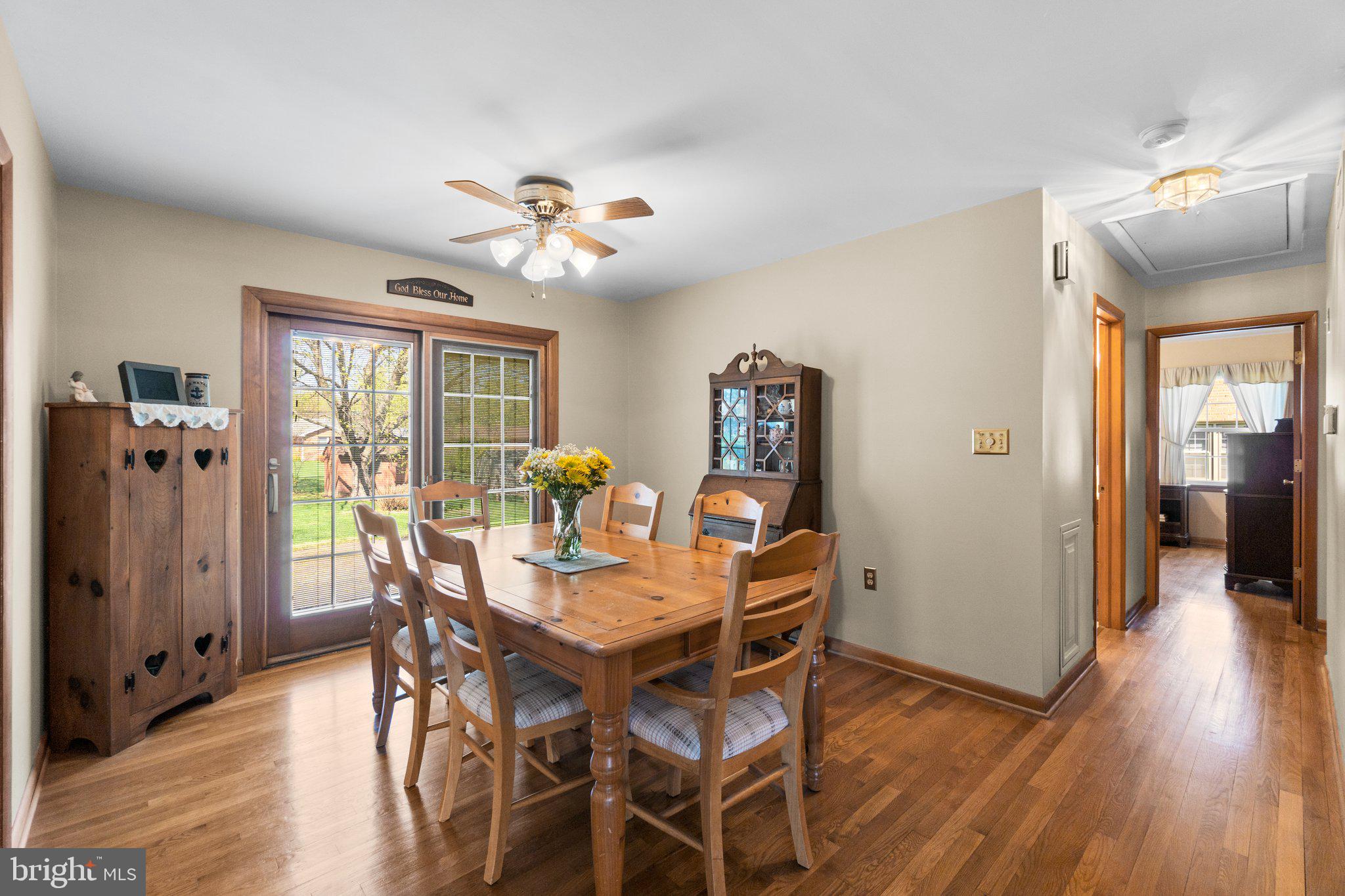 8008 Meadowview Drive Frederick, MD 21702 - Photo 9 of 42 a view of a dining room with furniture window and wooden floor