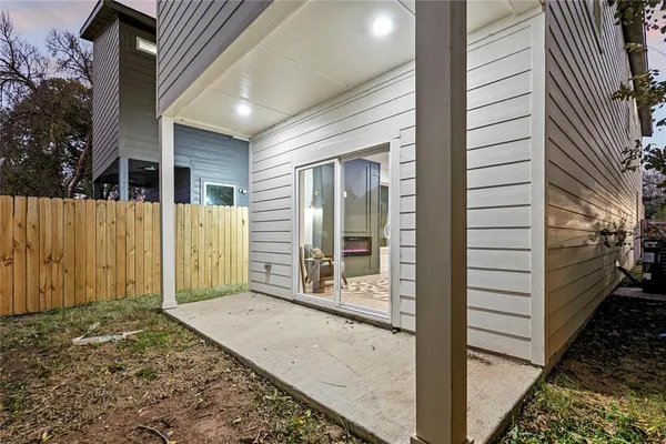 a view of a porch with a wooden fence