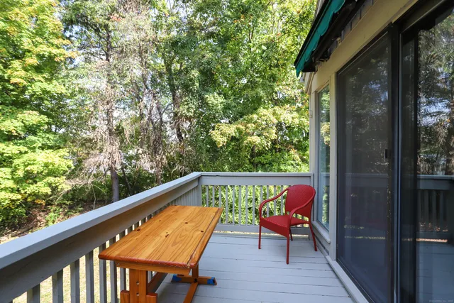 a view of sitting area with furniture and wooden deck