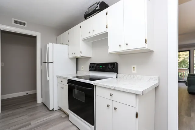 a kitchen with a sink a stove and refrigerator