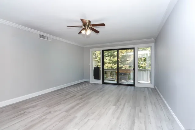 a view of an empty room with a window