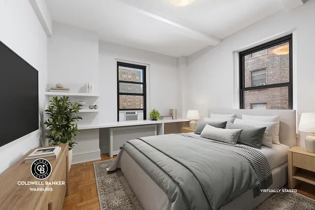 a bedroom with a balcony a bed and a window